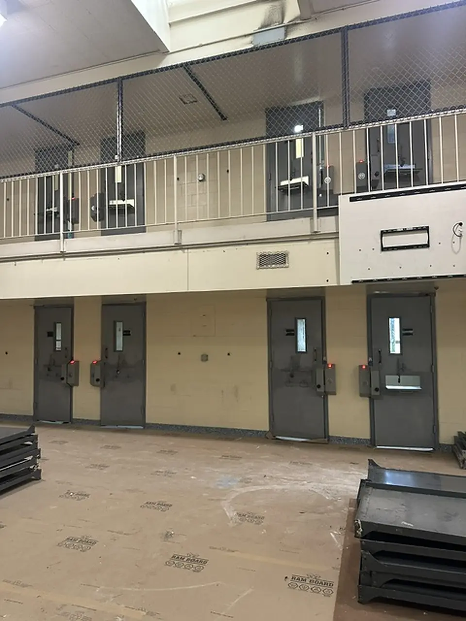 Two tier housing unit during a lock retrofit