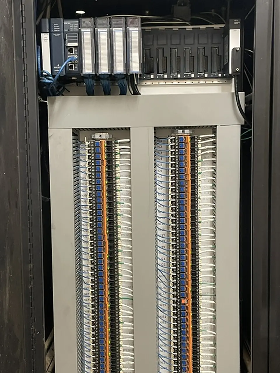 PLC rack above labelled field terminations