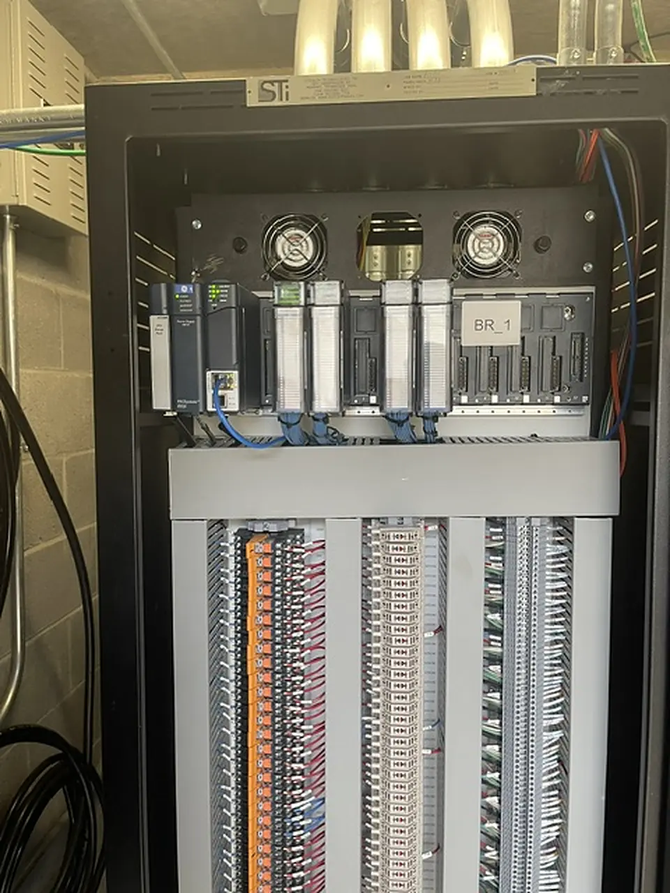 PLC rack and terminal strips in an equipment room